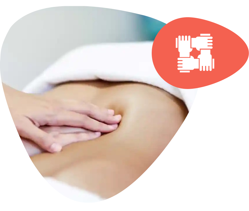 Therapist performing a lymphatic drainage massage in a spa setting.