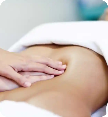 Therapist performing a lymphatic drainage massage in a spa setting.
